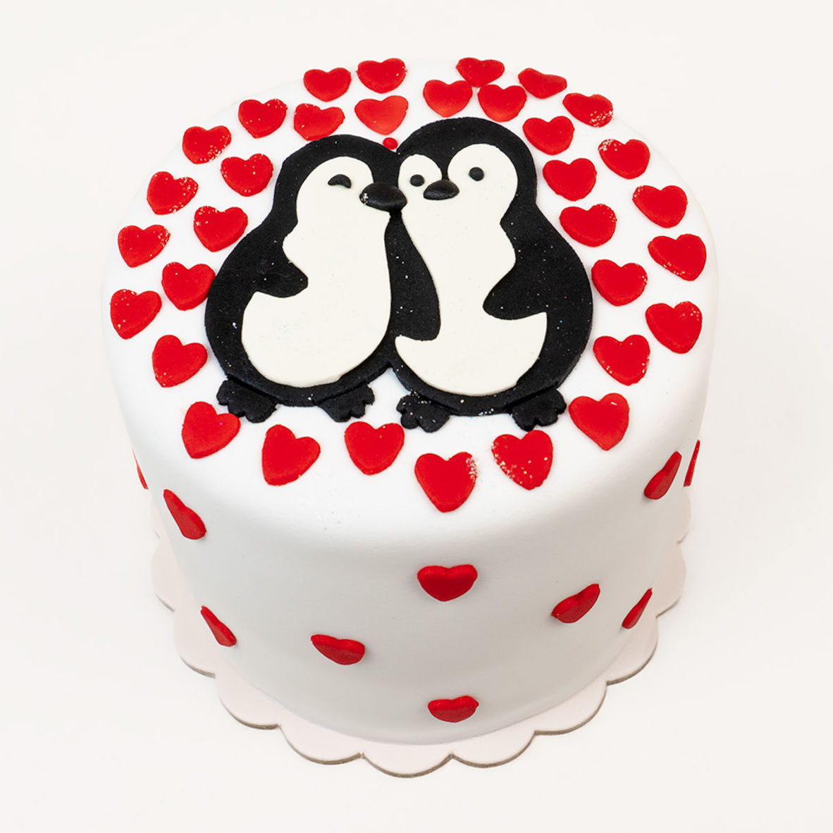 Torta con temática de pingüinos enamorados