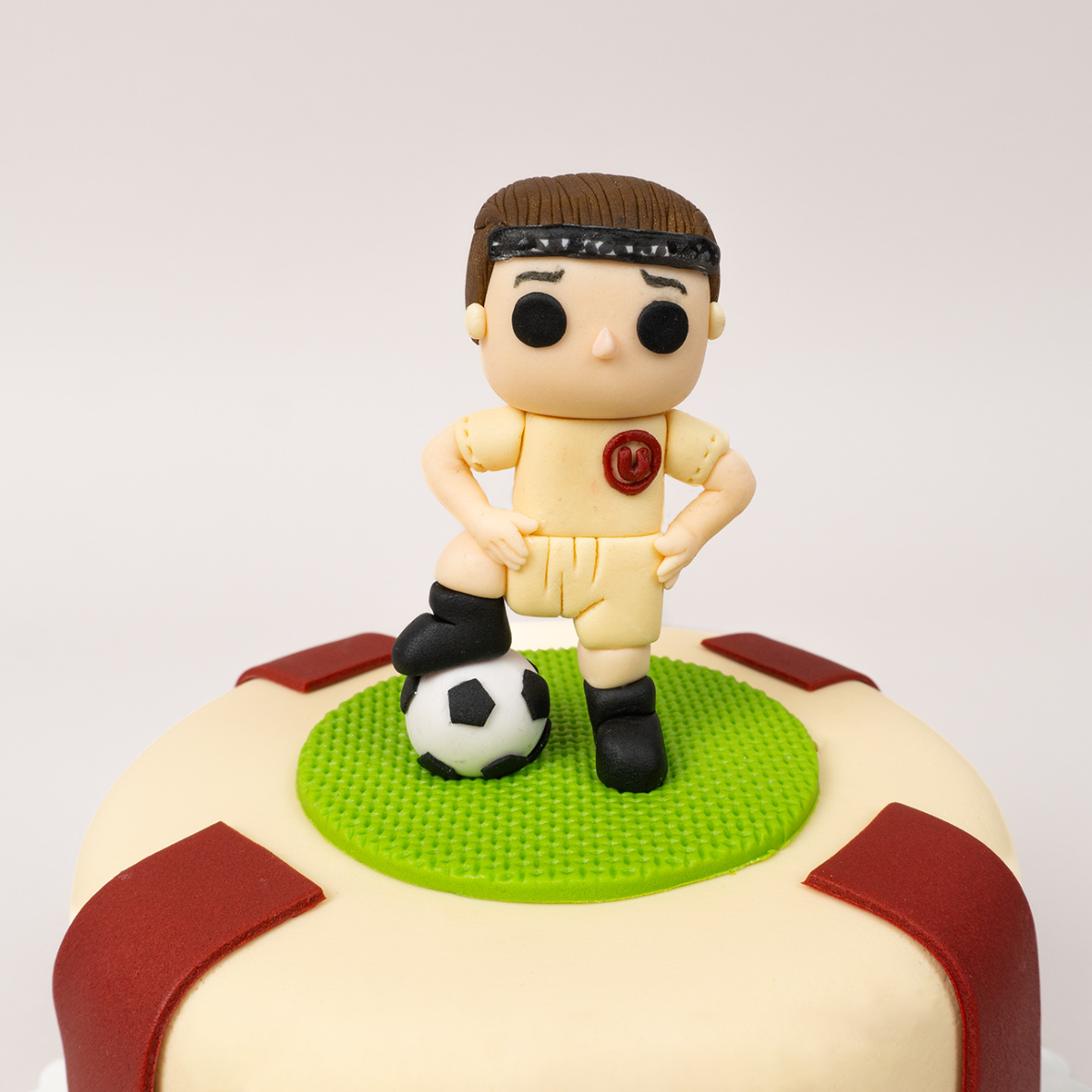 Torta de la U con muñeco