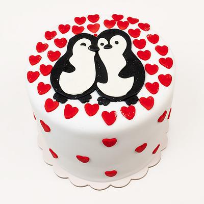 Torta con temática de pingüinos enamorados