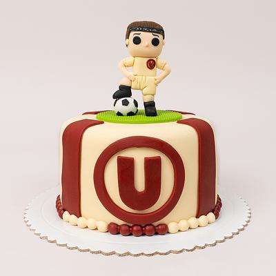 Torta de la U con muñeco